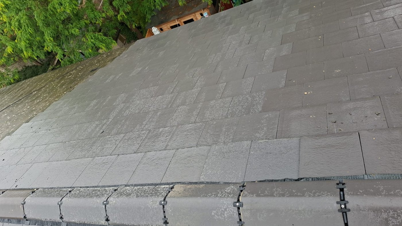 Close view of completed roof covering and ridge detail